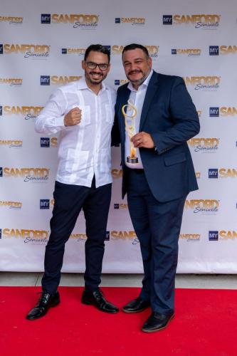 2024 Best of Sanford Awards-190 Julio in red carpet with friend by pete